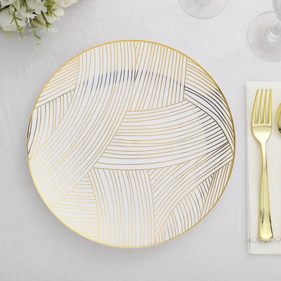 Gold-patterned dinner plate on a white background.
