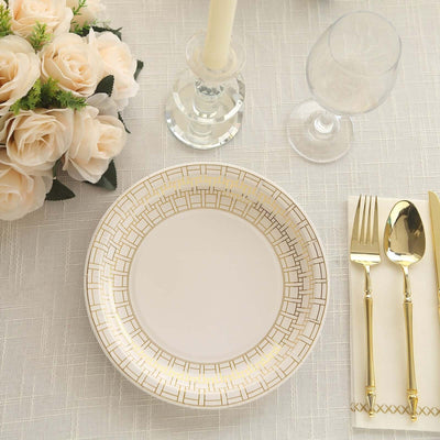 Elegant disposable plate with gold geometric design on a styled dining table.