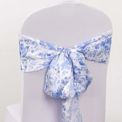 Blue floral chair sash tied on a white chair.