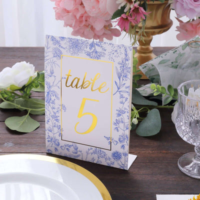 Table number card with floral design and gold lettering, ideal for wedding decor.