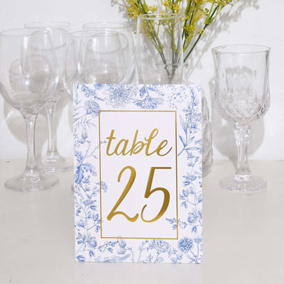 Table number 25 with floral design in a clear glass setting.