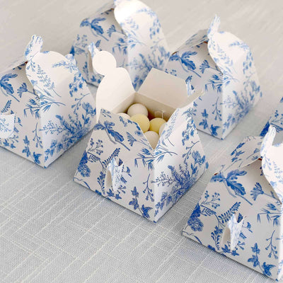 Decorative gift boxes with floral design, some open revealing treats inside.