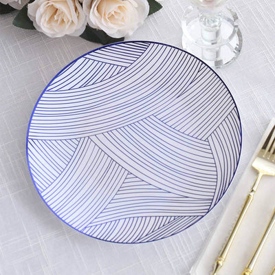 Decorative blue and white patterned plate on a textured tablecloth.