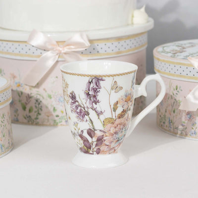 Floral-patterned porcelain mug on a plain background.