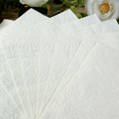 Textured white paper sheets stacked in a fan arrangement.