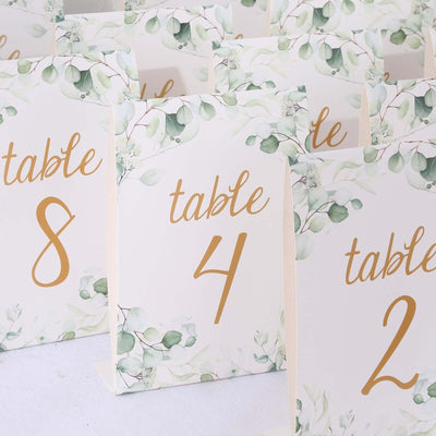 Table numbers with floral design for event decoration.