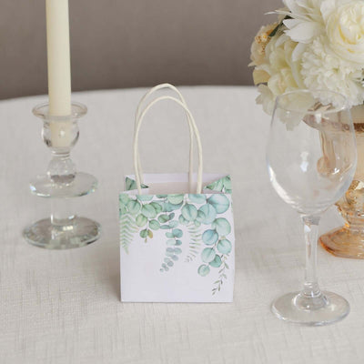 Decorative gift bag with floral design on table setting.