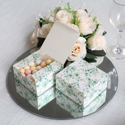 Decorative gift box filled with colorful candies, set on a mirrored surface.