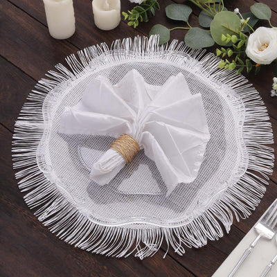 White fringed placemat with a folded napkin and decorative ring