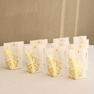 Elegant floral gift boxes with gold accents arranged neatly.