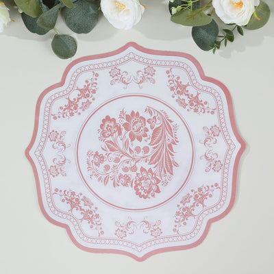 Pink floral decorative placemat with intricate design on a white background.