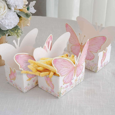 Butterfly-themed snack boxes with fries on a table setting.