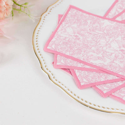 Pink floral note cards stacked on a decorative plate.