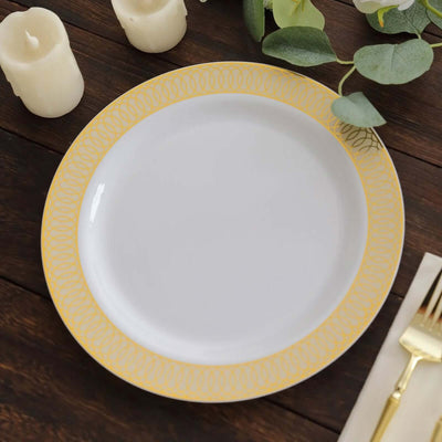 White plate with a yellow decorative rim on a wooden table setting.
