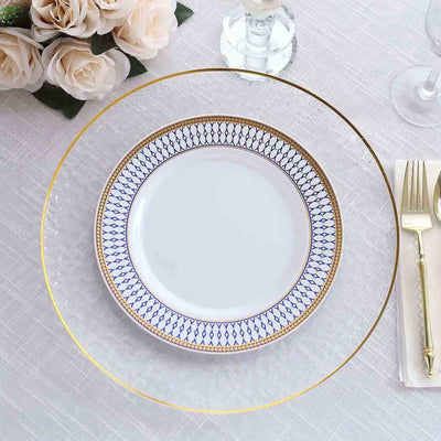 Elegant dining setup with a decorative plate and gold-rimmed glass charger.