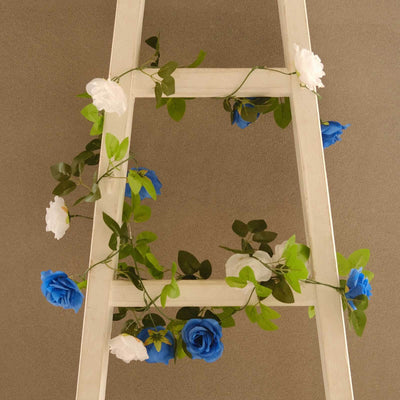 Decorative ladder with blue and white floral garland.