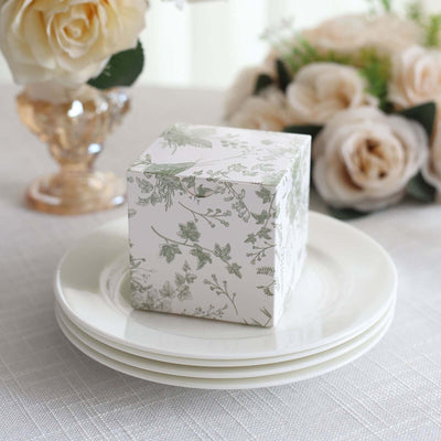 Decorative gift box with floral design on a dining table setting.