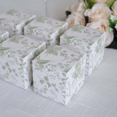 Decorative floral gift boxes arranged on a table.