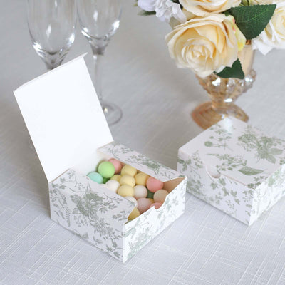 Decorative gift box filled with colorful candies, set on a table.