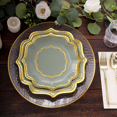 Elegant disposable plates with gold trim on a rustic wooden table setting.