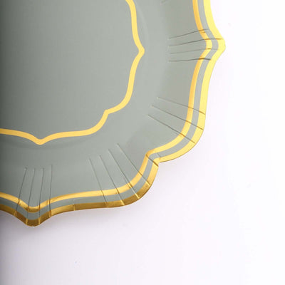 Elegant green plate with gold trim and scalloped edges.