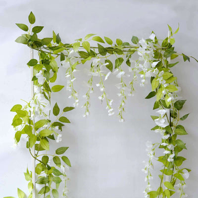 Artificial wisteria vine garland with green leaves and white flowers