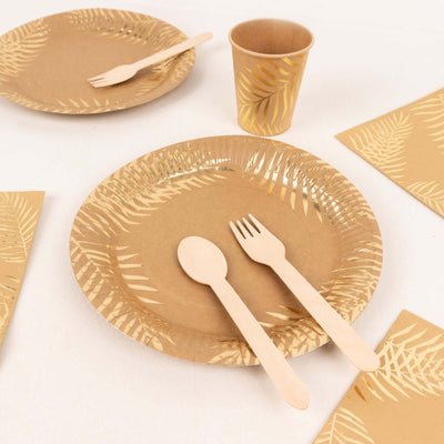 Eco-friendly disposable plates and utensils in a tropical design.
