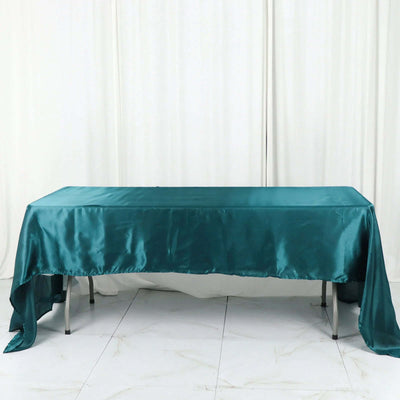 Teal satin tablecloth draped elegantly over a table.