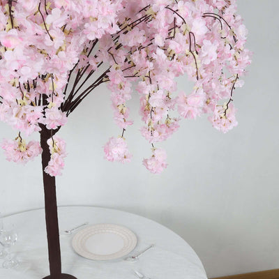 Artificial cherry blossom tree in pink, perfect for decor.