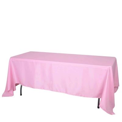 Pink tablecloth draped over a rectangular table