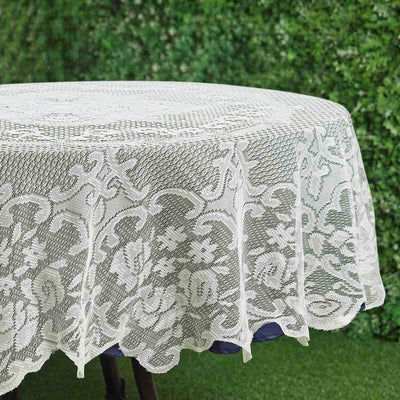 Lace tablecloth with floral design on a round table