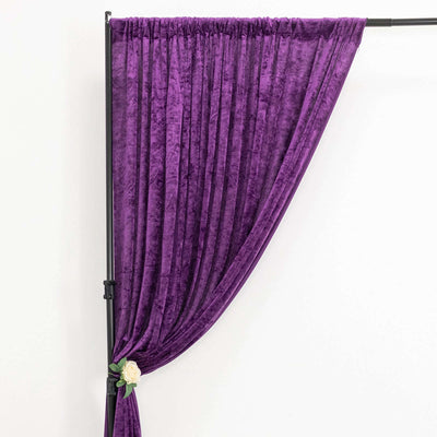 Purple velvet curtain draped elegantly on a black stand