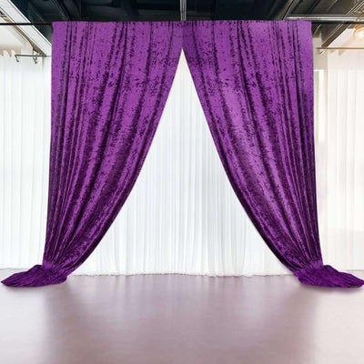 Purple velvet curtains draped elegantly in a studio setting.