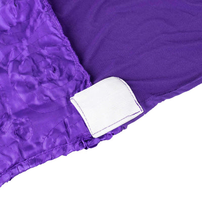 Purple fabric with floral texture and white label tag