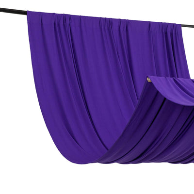 Purple drapery fabric on a rod, showcasing elegant folds and texture.