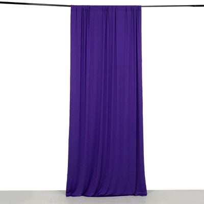 Purple fabric drape hanging from a rod against a white background.
