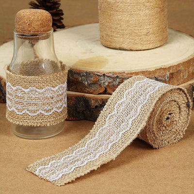 Burlap ribbon with lace detail, decorative glass bottle, and wooden base.