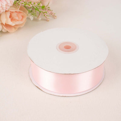 Pink satin ribbon spool for crafting and decoration supplies