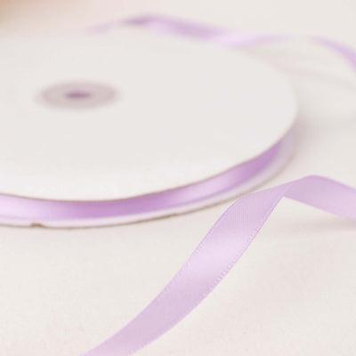 Lavender ribbon on a spool with a trailing end