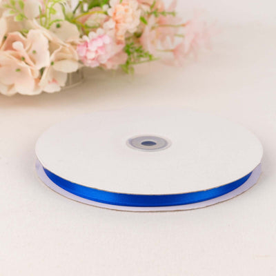 Blue ribbon spool on a white background