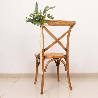 Wooden chair with floral arrangement tied to the back