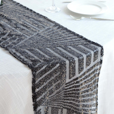 Decorative black lace table runner with geometric patterns.