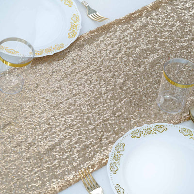 Elegant gold sequin table runner with fine china and glassware set for dining