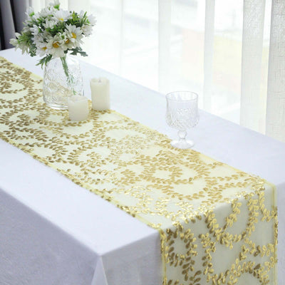 Gold sequined table runner on a white table with decorative accents.