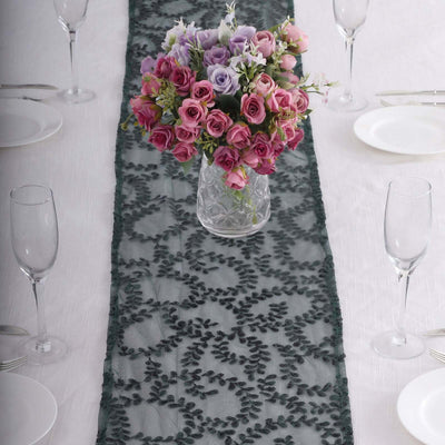 Elegant lace table runner with a floral centerpiece on a dining table.