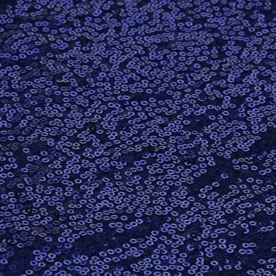 Navy blue fabric with sequins in a scattered pattern.