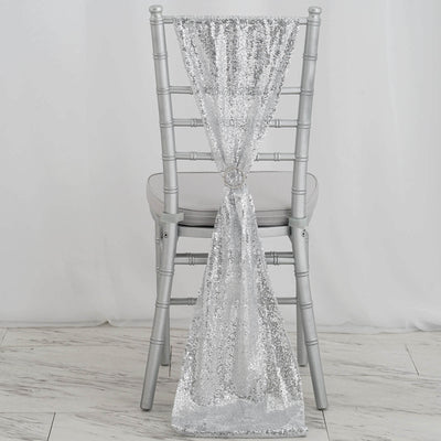 Silver sequin chair cover draped elegantly on a silver chiavari chair.