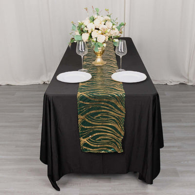 Elegant black tablecloth with gold and green runner, styled with floral centerpiece.