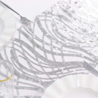 Silver sequined table runner on a white background