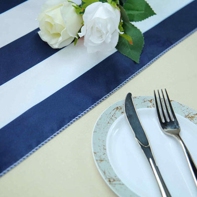 Navy and white striped table runner with roses, plate, knife, and fork.